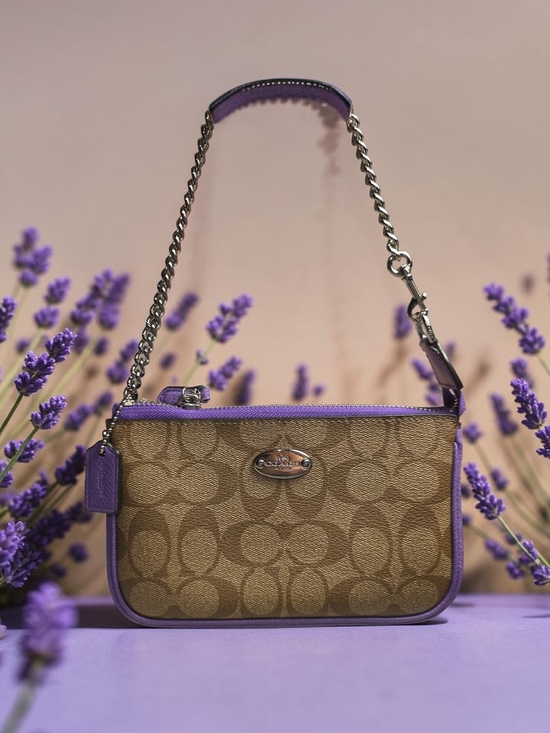 Coach Handbags - 🔥LOW START🔥Coach Signature Canvas Wristlet with Purple Trim